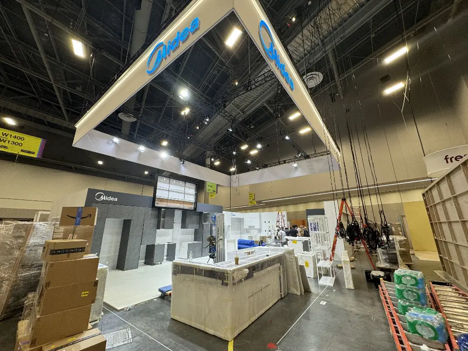 During installation: kitchen counter area surrounded by cartons under the hanging frame