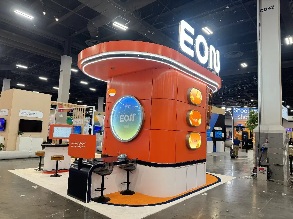 EON tower with demo stations and bar stools on white floor