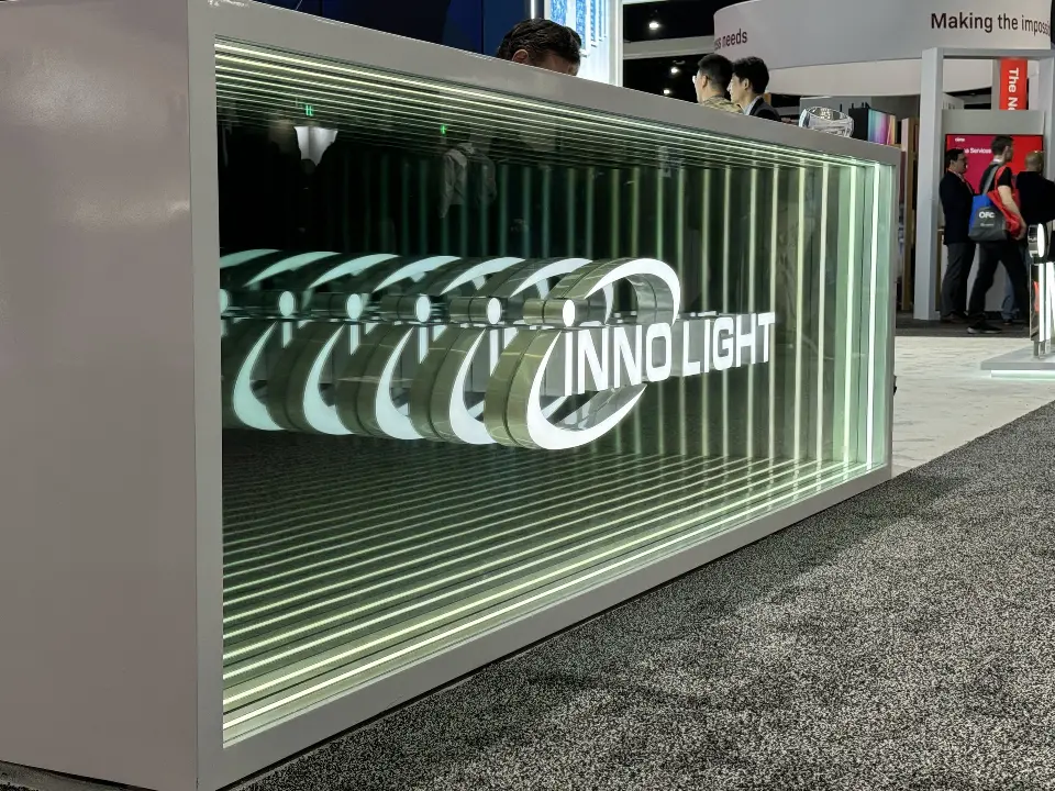 Close view of the mirror-tunnel panel repeating the InnoLight logo into depth