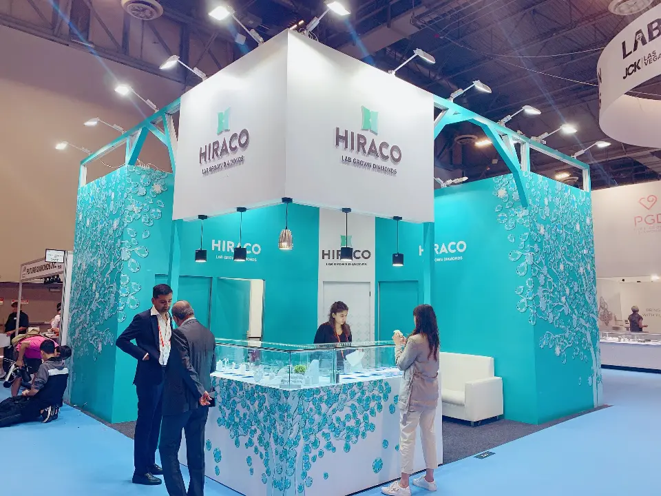 Visitors at the tree-print counters in front of the teal walls