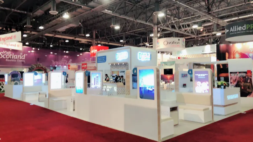 Long side view with lounge seating and tall blue lightboxes