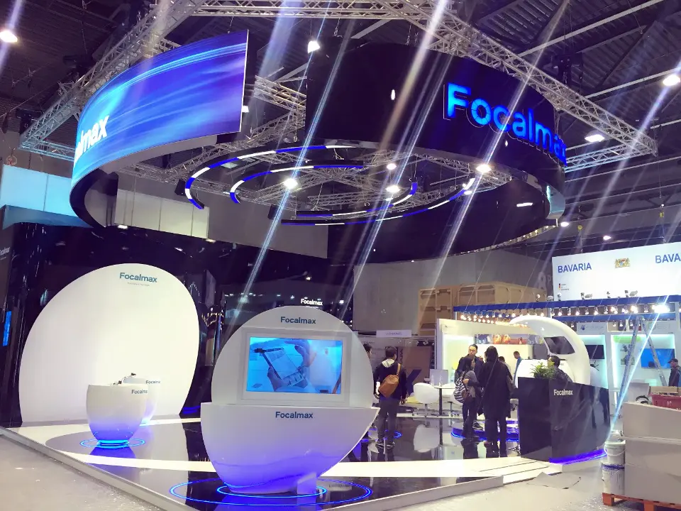 Visitors at the egg kiosks with light flares from the ceiling ring spotlights