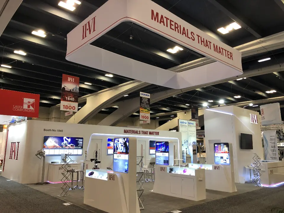 Wide view under the Materials That Matter hanging sign with product towers below
