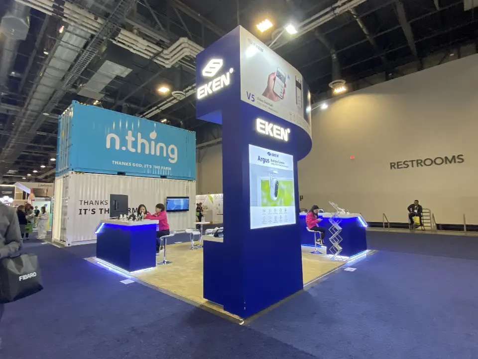 Navy tower with a screen and EKEN logo seen from the side aisle