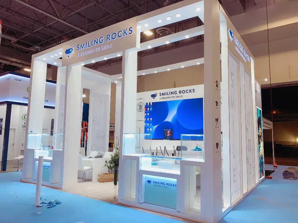Finished white frame with blue header, video screen and lit glass showcases