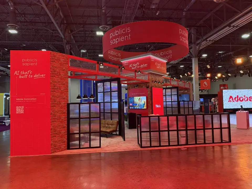 Front view of black grid partitions and lounge seating under the red ring