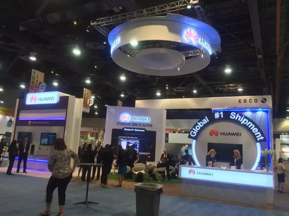 Front view of the Global #1 Shipment wall with visitors along the aisle