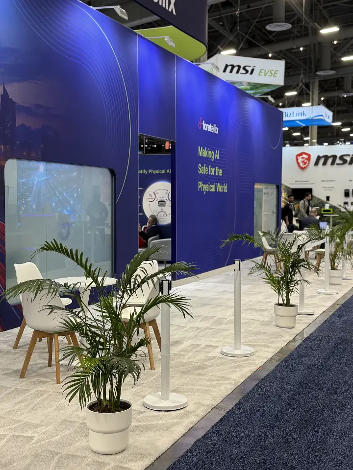 Side wall with palms and chairs seen along the aisle
