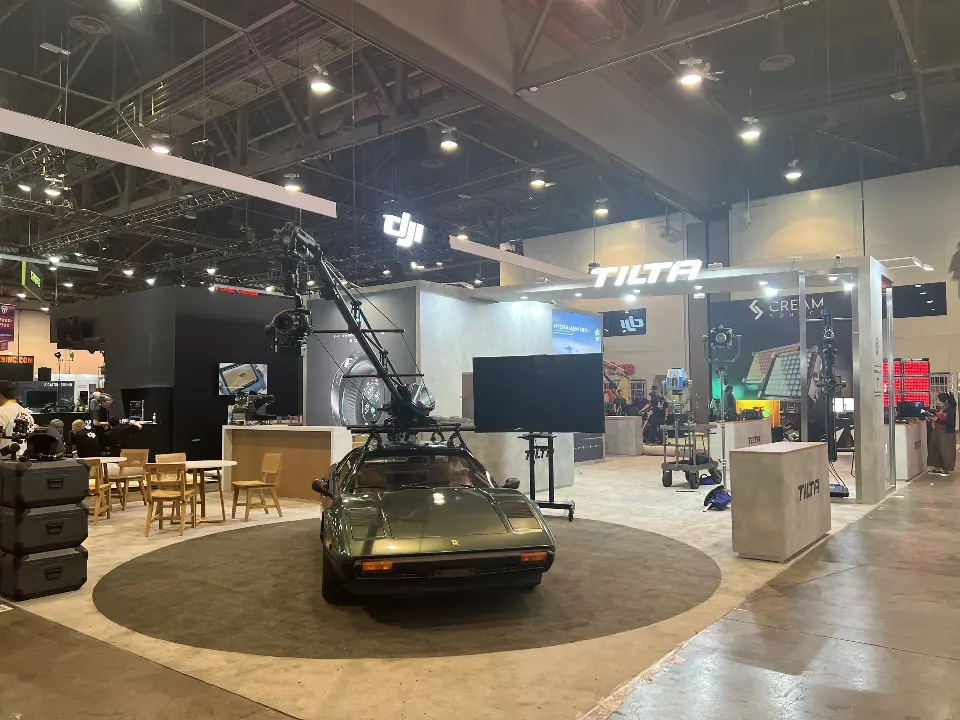 Front view of the car carrying a camera crane, video screen on a stand and Tilta counters