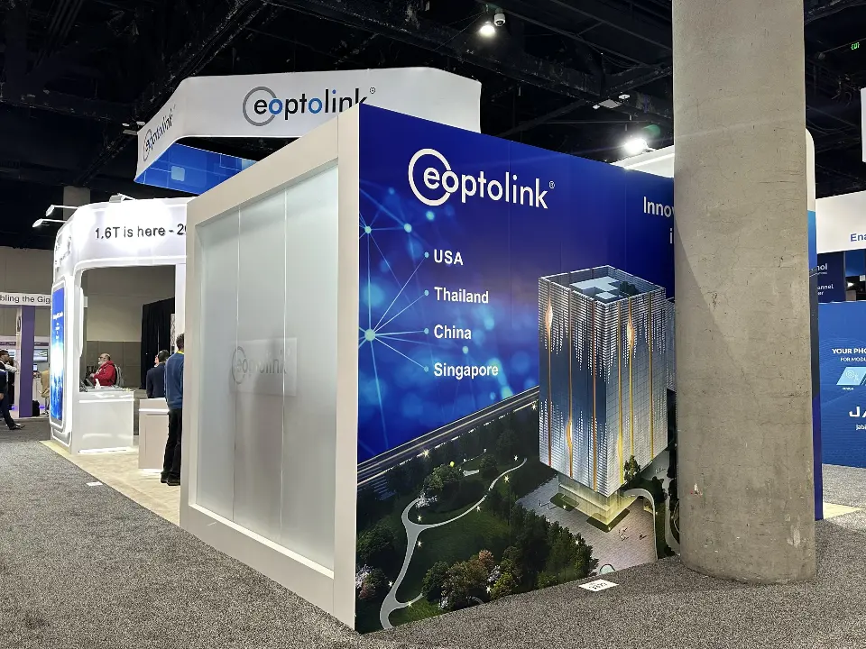 Frosted cube with location list and skyline graphic beside a hall column