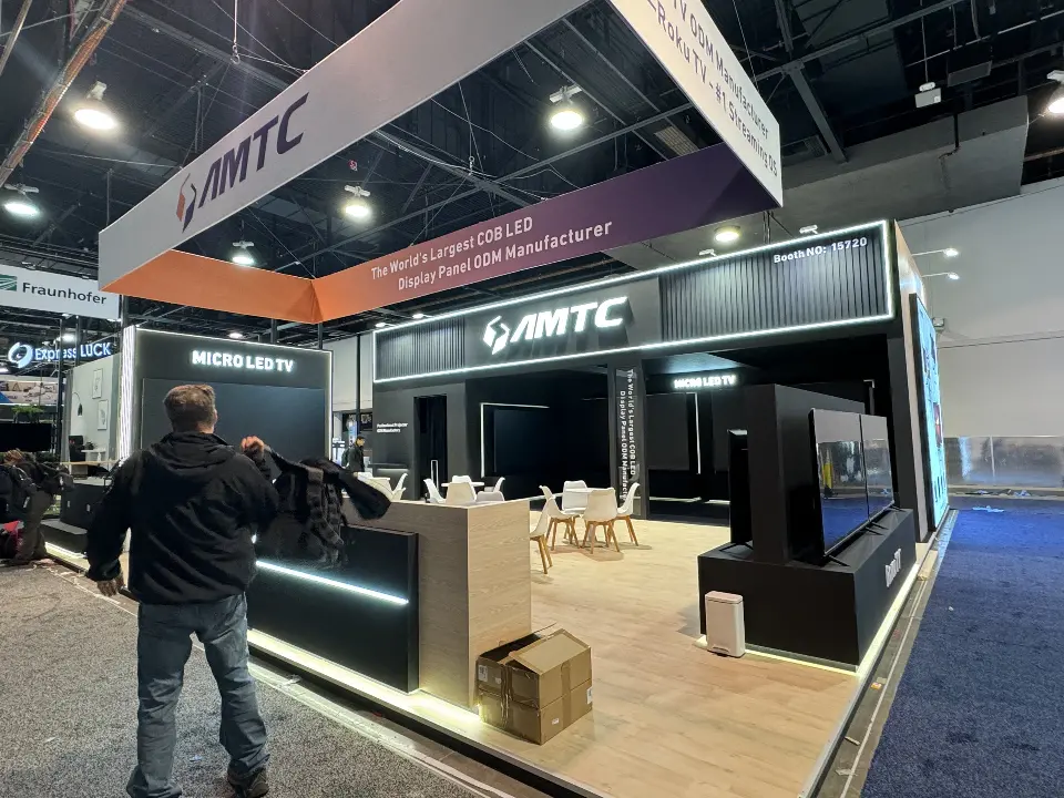 Front corner with lit counter, black walls and wood-look flooring