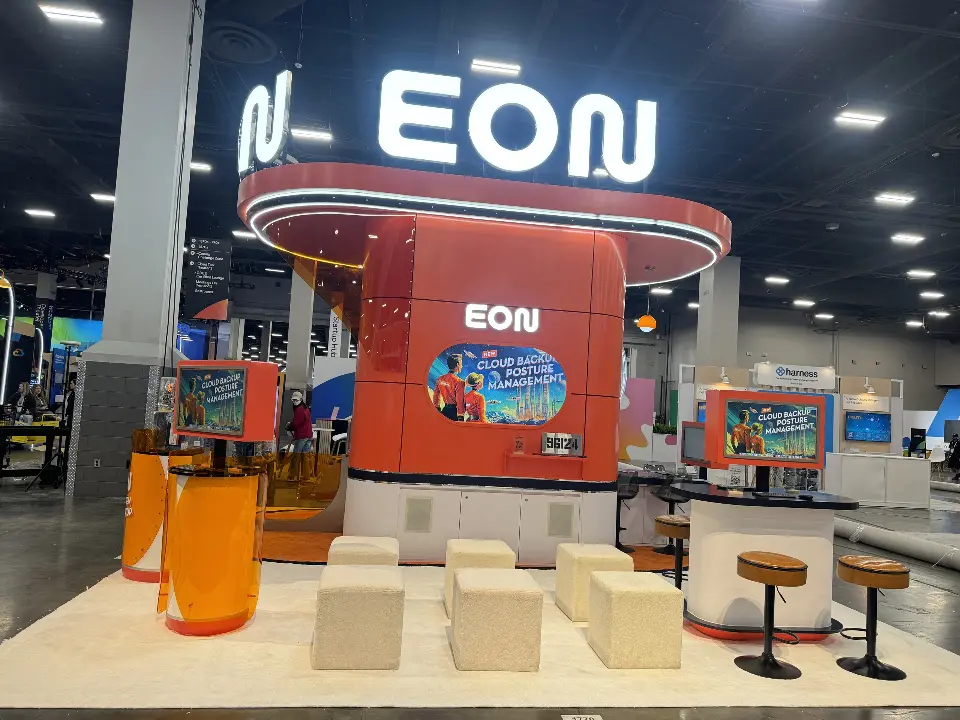 EON booth with cube seats, bar stools and screen wall