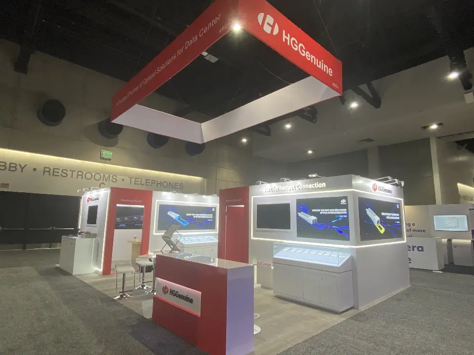 Front view of the finished booth with red counter and white display walls