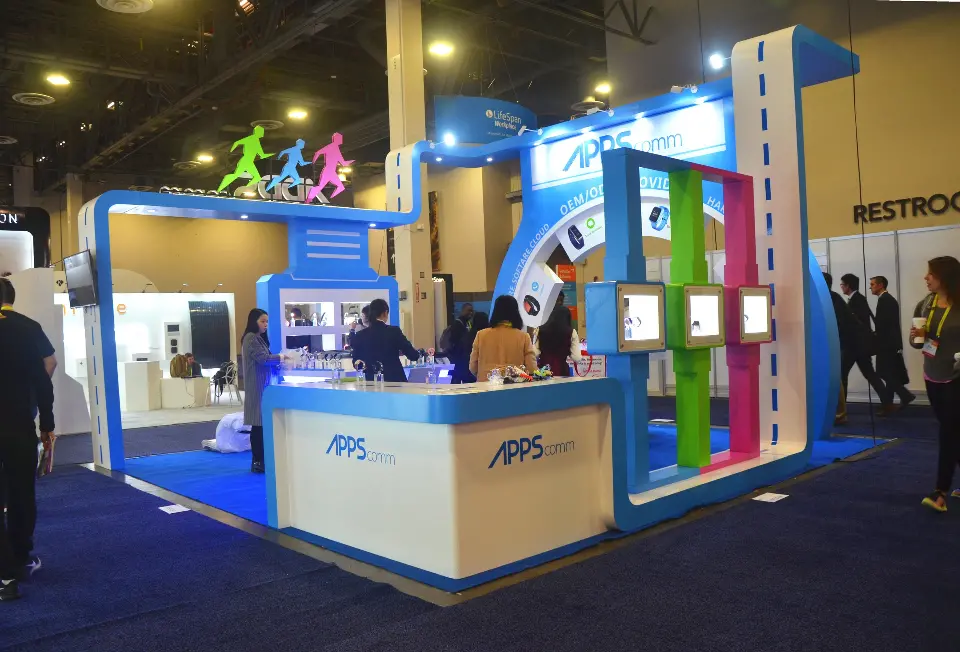 Wide view of the booth with wall screens and colourful vertical panels