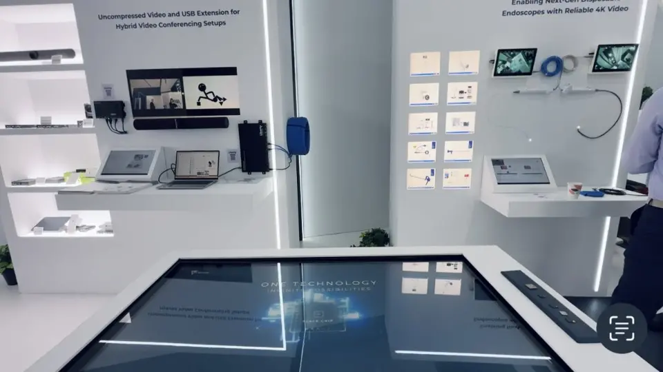 Touchscreen table in front of a wall of product sample cards