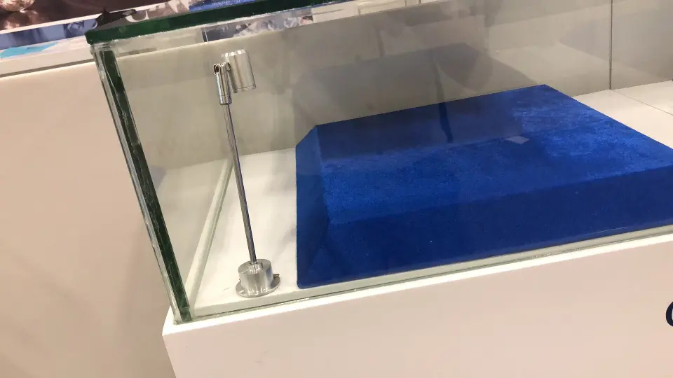 Close detail of a glass showcase corner with its blue velvet display tray