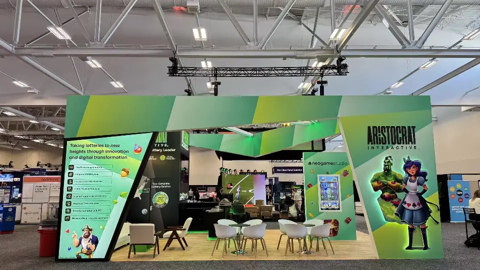 Wide front view of the green faceted frame, side information wall and seating area