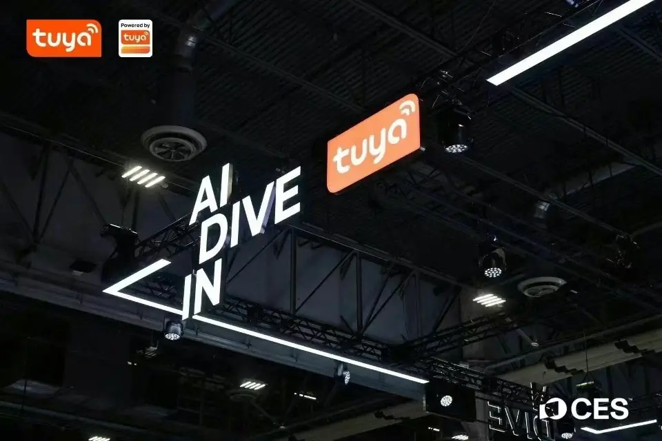 Tuya AI Dive In lettering in lit lines beside the orange Tuya logo