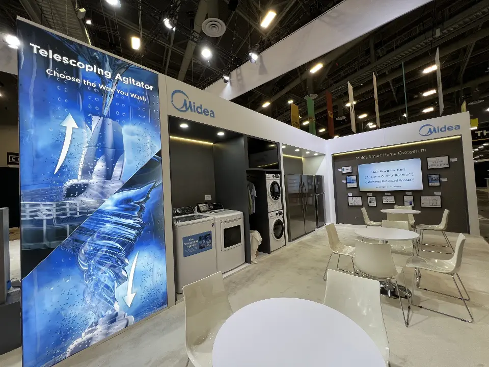Tall backlit graphic of a washer agitator next to the seating area