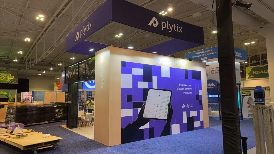 Outer wall with purple graphic and wall screen beside the wood-look corner