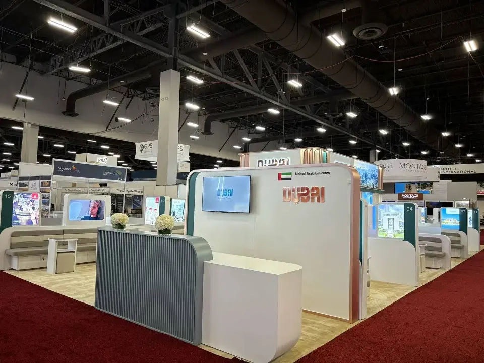 Side view of a Dubai meeting pod with white panels and wall screen