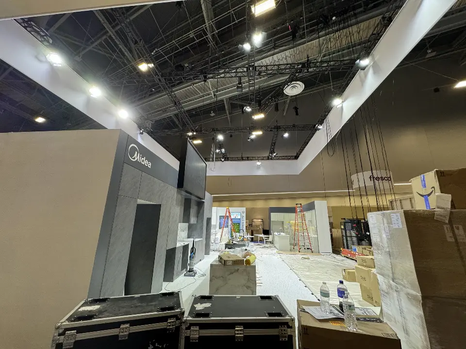 During installation: grey kitchen wall with road cases on the floor