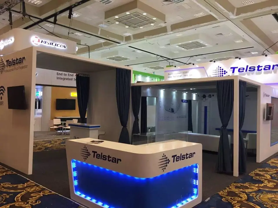 Closer angle of the blue-lit counter with curtained rooms behind