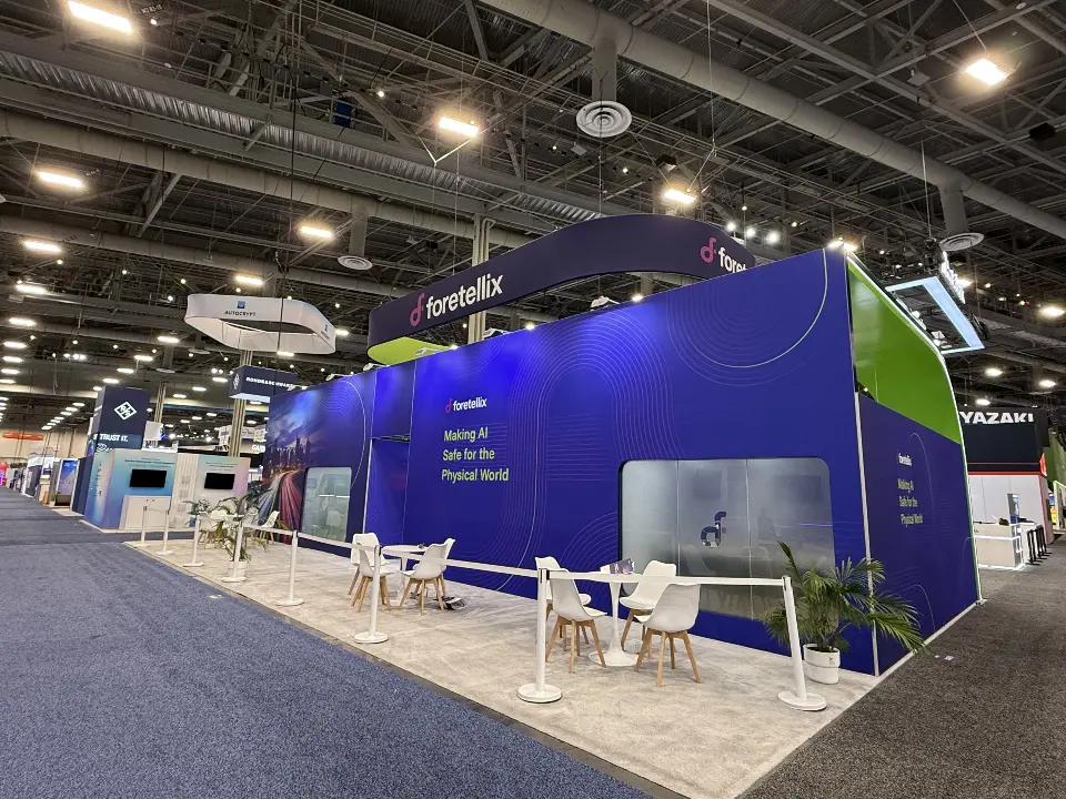 Back elevation with frosted glass rooms and white cafe tables