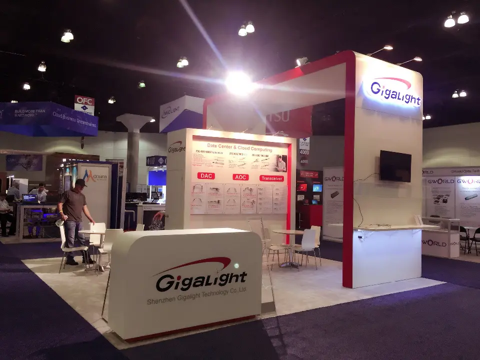 Gigalight booth with white logo counter, red frame and product graphic wall