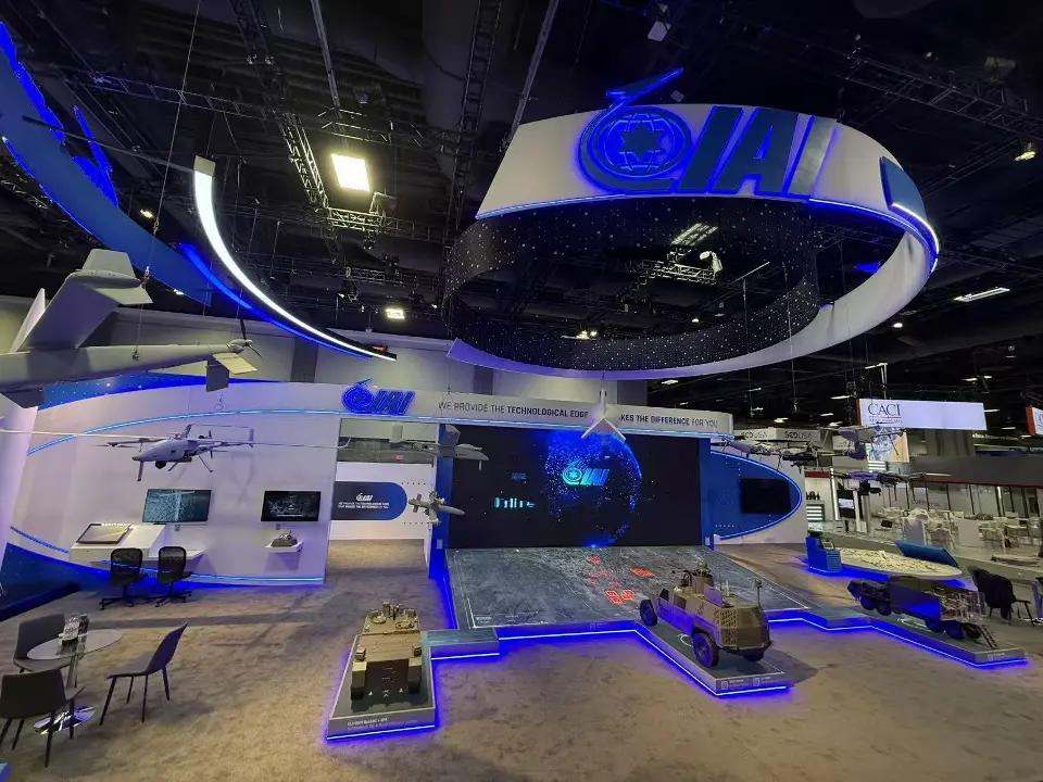 Corner view with the hanging IAI ring, aircraft models and blue-lit vehicle displays