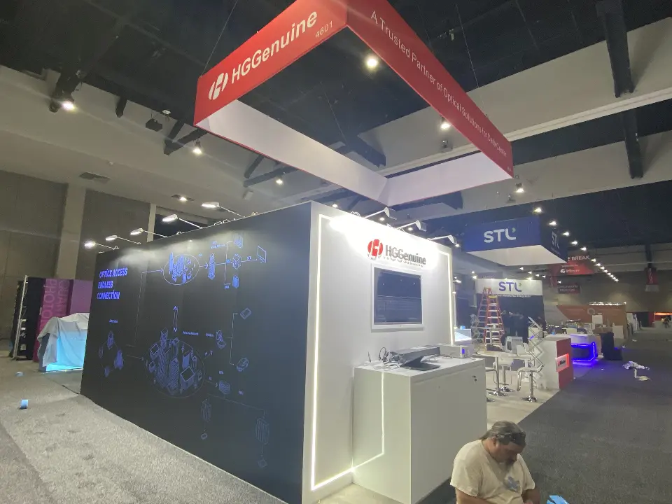 Side view of the dark blue wall with a small white counter and screen