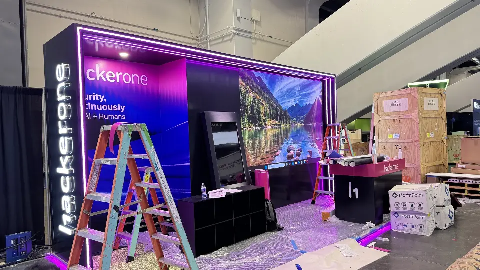 Back wall mountain graphic with a ladder in front during set-up