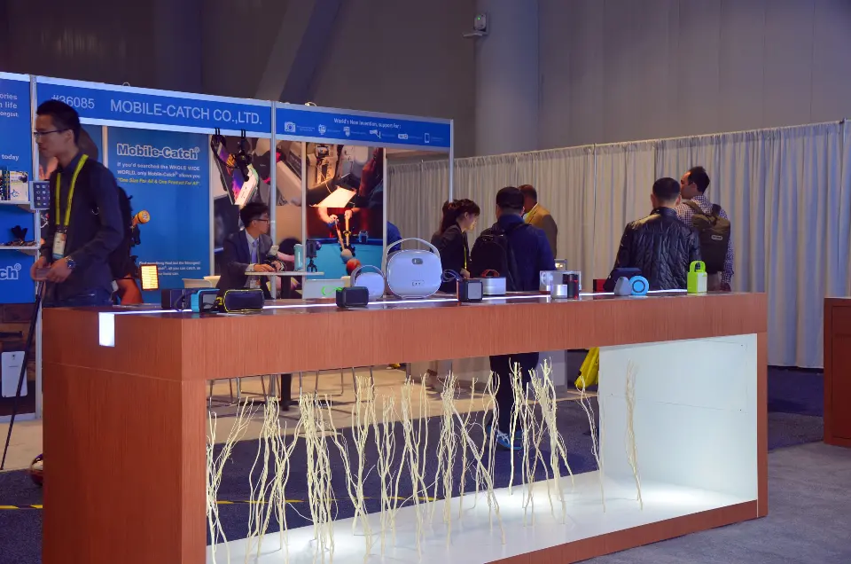 Visitors at the front counter with lit base and wood-look top