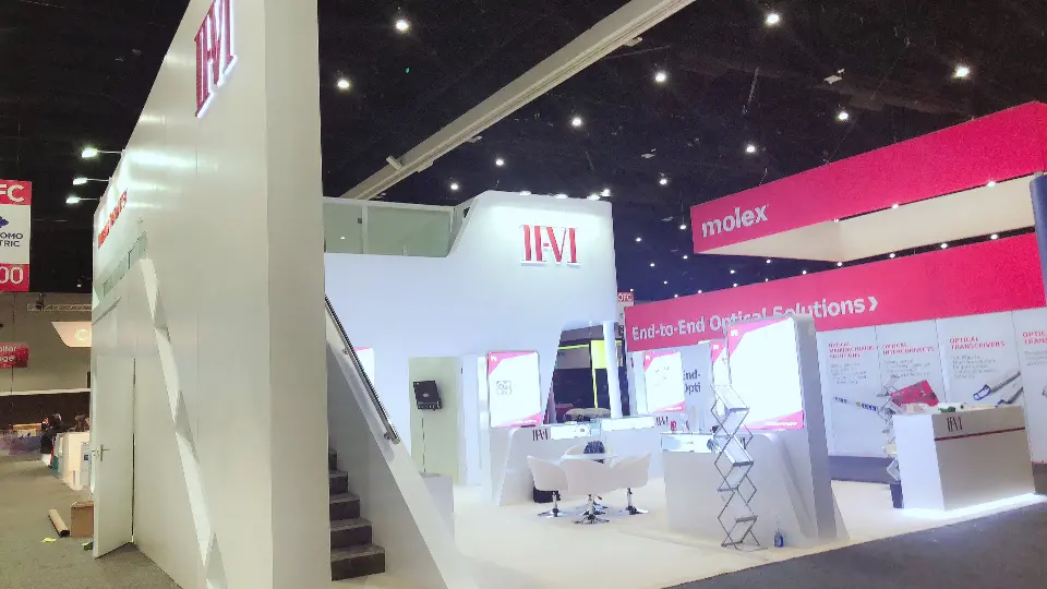 Side view along the staircase wall with backlit panels and display counter