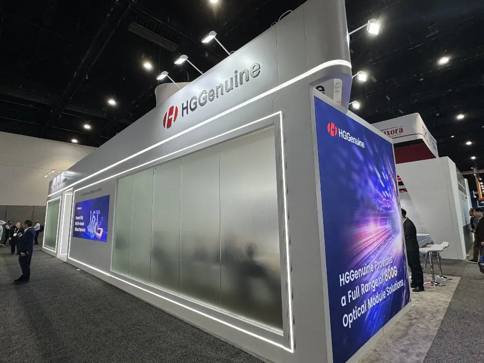 Frosted glass meeting room wall framed by light strips under the HGGenuine name