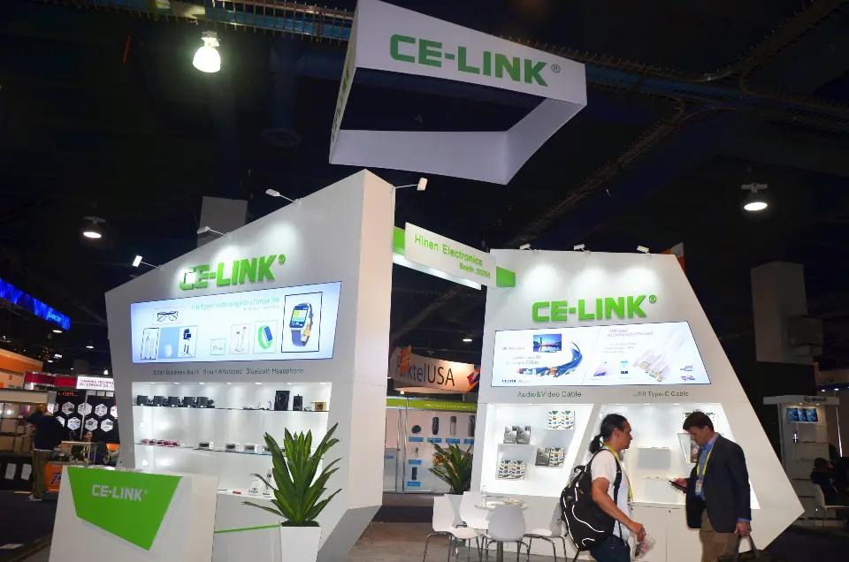 CE-LINK hanging sign above the angled walls with visitors below