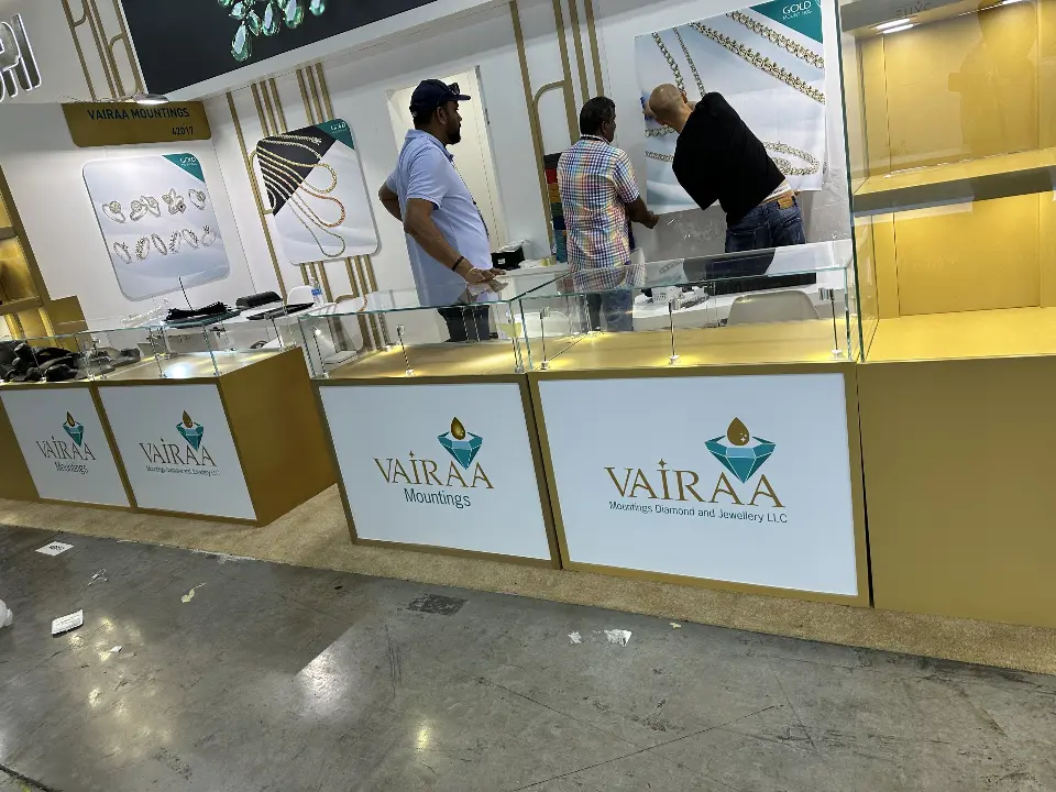 Close view of Vairaa counters with exhibitors and visitors talking